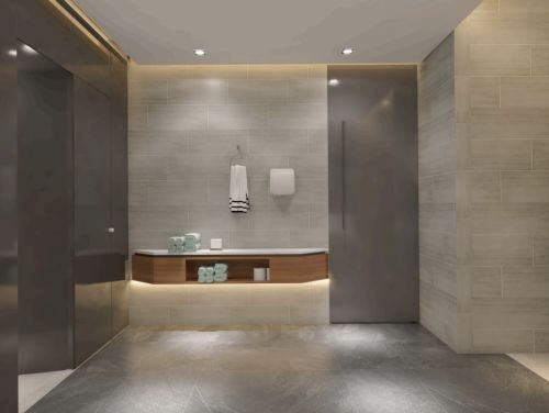 Modern spa bathroom with tiled walls, wooden vanity, towels, and walk-in shower enclosure